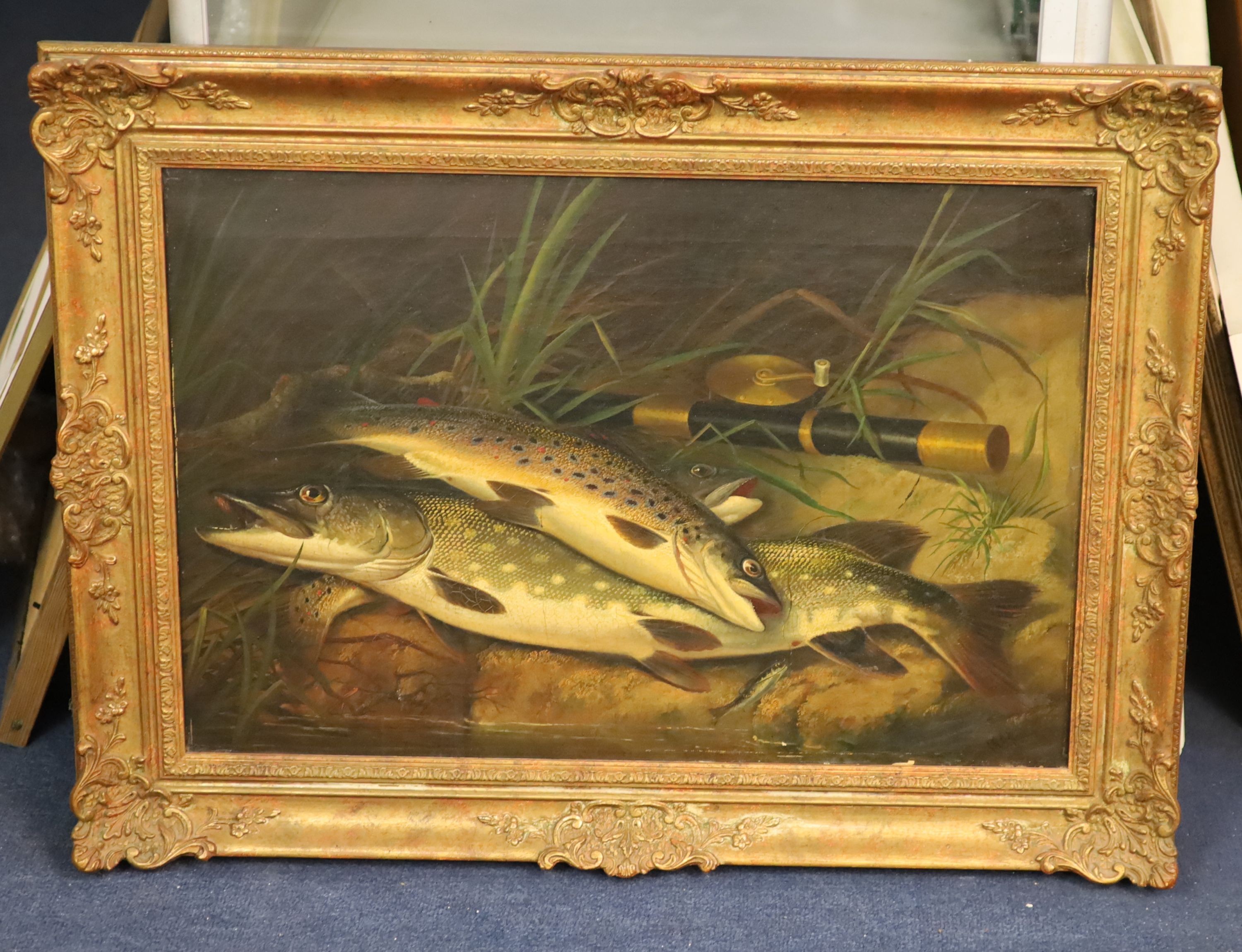 Thomas G. Targett (fl.1868-1896), Rainbow Trout and Pike on a riverbank beside a rod and reel, oil on canvas, 40 x 60cm